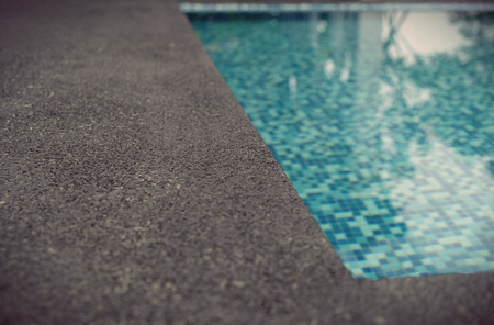 water swimming pool with sunny reflectionsの写真素材