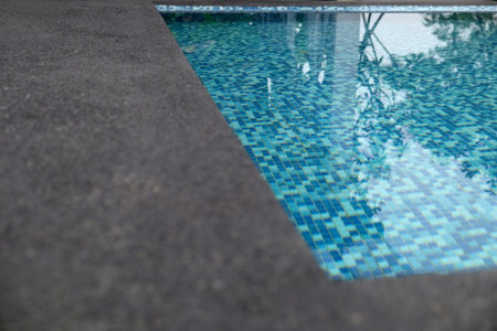 water swimming pool with sunny reflections