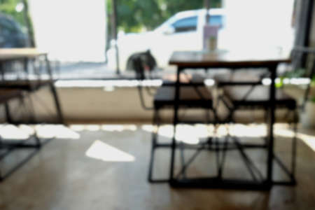 Coffee shop blur background with bokeh light with vintage filterの写真素材