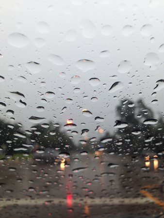 Outside the car in the raining day, View from car seat. focus rainの写真素材