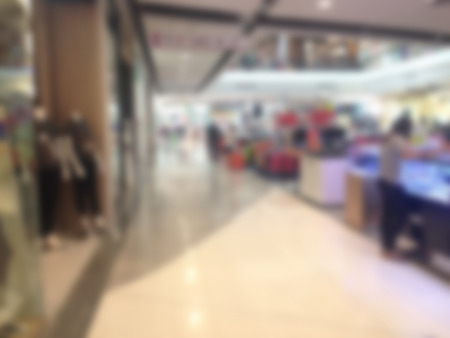 blurred image of shopping mall and people, in department store.の写真素材
