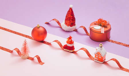 Pattern of red Christmas decorations with one broken on a pastel background. Minimal New Year decoration concept. Creative idea background. 2022の写真素材