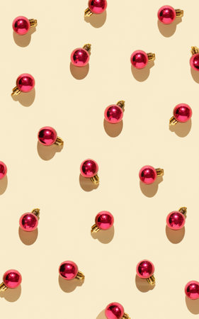 Neatly scattered red Christmas decorations on a pastel background. Creative composition xmas. New...