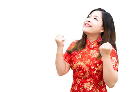 Beauty woman wear cheongsam and feel excited with Chinese new year on isolated white background.の写真素材