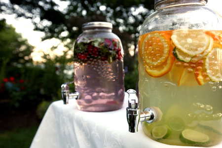 Lemonade and fruit drinks in glass despensing containers