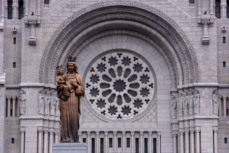 Old church face in Canada with statue in frontの写真素材