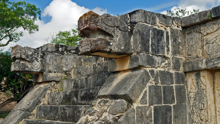snake stone head in the Chichen Itza, mayan pyramid in Yucatan, Mexico