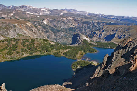 looking off the top of a mountain in Montana over a lakeの写真素材