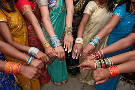 India women in colorful dresses and wrist jewelryの写真素材