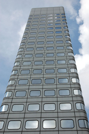 Business building with with reflection of sky and cloud