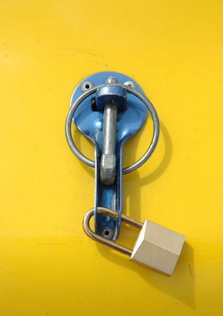 Security lock against yellow background