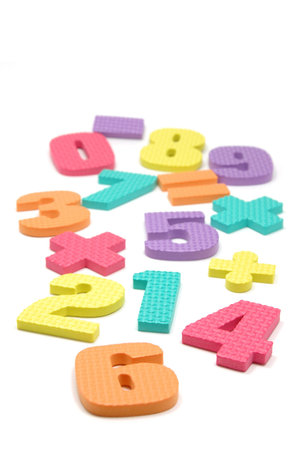 Foam numbers and maths symbols in isolated white background