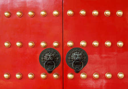 Chinese temple door with lion knobの写真素材