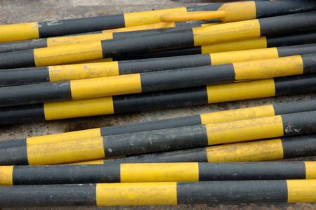 Caution bars in yellow and black patternの写真素材