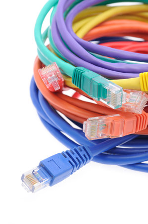 Close up of multi color network cables over white