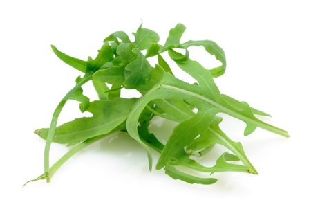 Pile of ruccola leaves in isolated white backgroundの写真素材