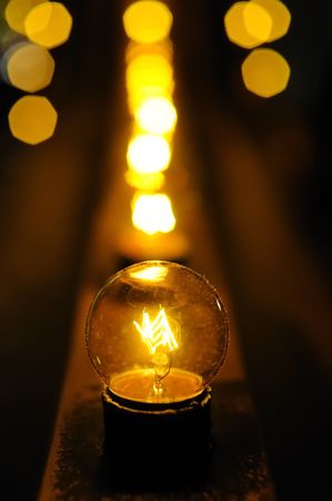 Row of bulbs in abstract light background (shallow DOF)の写真素材