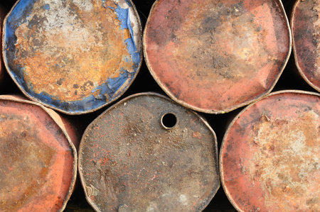 Background of old rusty drums for industrial useの写真素材