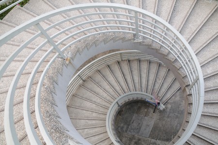 Downward view of a sprial staircaseの写真素材