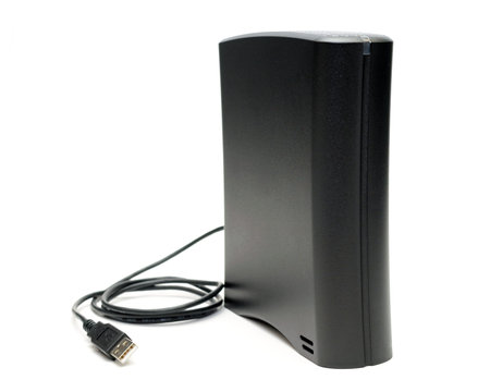 Desktop external hard drive with USB cable, isolated on white background