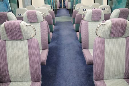 Interior of a passenger train with empty seatsの写真素材