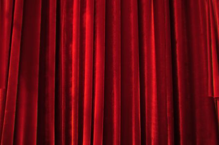 Theater stage red curtains with light and shadowの写真素材