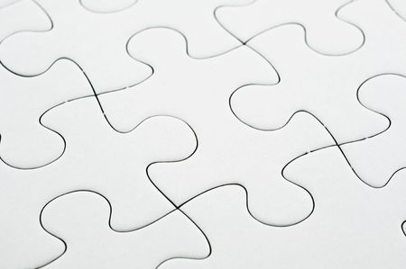 Close up of white jigsaw puzzle backgroundの写真素材