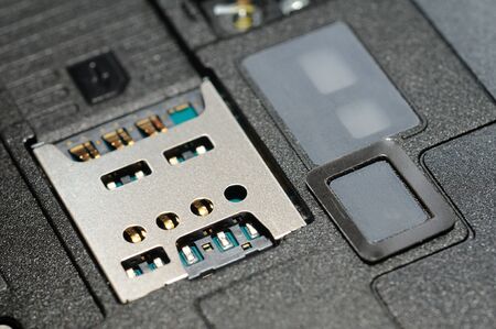 Closeup of mobile micro sim card slotの写真素材