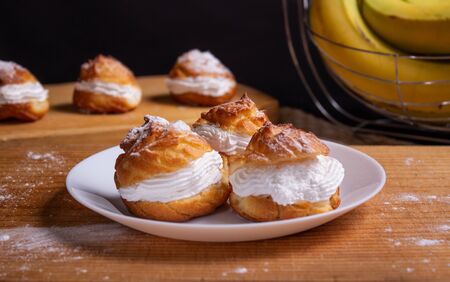 homemade eclair with vanilla and whiped creamの写真素材