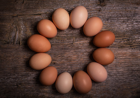 fresh colorful eggs in a wooden background