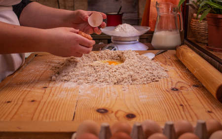 woman making homemade white bread in a kitchenの写真素材