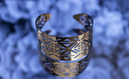 silver bracelet on blue backgroundの写真素材