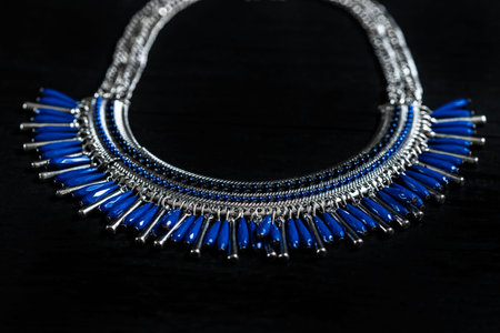 beautiful blue necklace on a black background