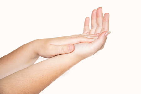 Close-up of woman's hand isolated on white background. Woman cleaning hands.の写真素材