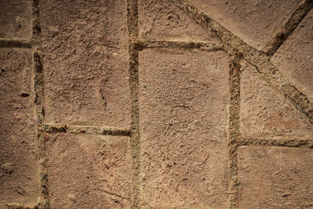 Texture of a stone wall. Old castle stone wall texture background. Stone wall as a background or texture. Part of a stone wall, for background or texture.の写真素材