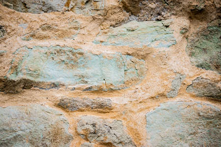 Texture of a stone wall. Old castle stone wall texture background. Stone wall as a background or texture. Part of a stone wall, for background or texture.の写真素材