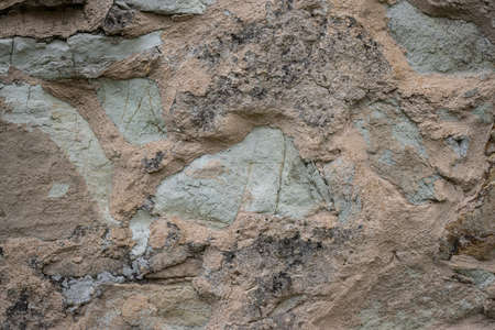 Texture of a stone wall. Old castle stone wall texture background. Stone wall as a background or texture. Part of a stone wall, for background or texture.の写真素材