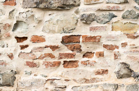 Texture of a stone wall. Old castle stone wall texture background. Stone wall as a background or texture. Part of a stone wall, for background or texture.の写真素材