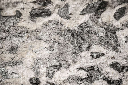 Texture of a stone wall. Old castle stone wall texture background. Stone wall as a background or texture. Part of a stone wall, for background or texture.の写真素材