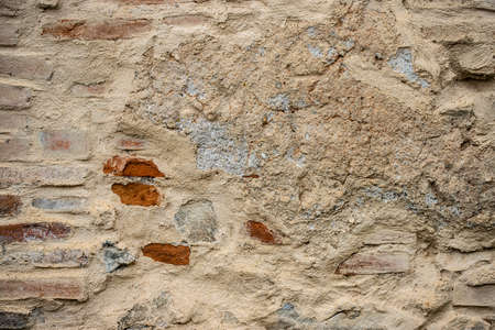 Texture of a stone wall. Old castle stone wall texture background. Stone wall as a background or texture. Part of a stone wall, for background or texture.の写真素材
