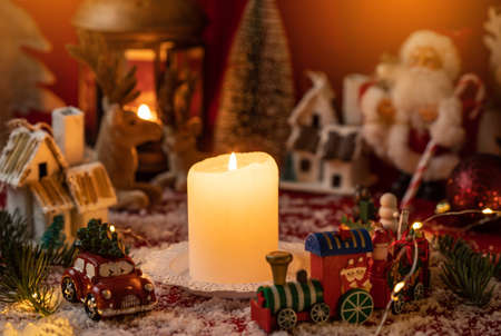 Candle surrounded with christmas decorations. Christmas country. Christmas concept.の写真素材