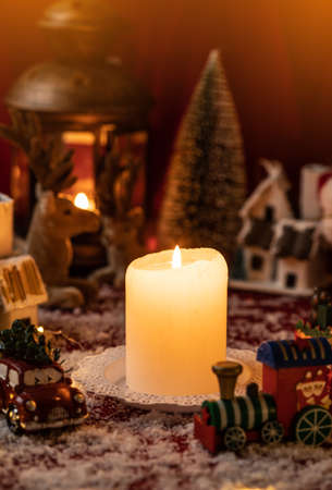 Candle surrounded with christmas decorations. Christmas country. Christmas concept.の写真素材