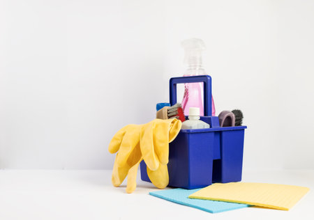 Cleaning equipments on a white background. Bottle with detergent on a white background.の写真素材