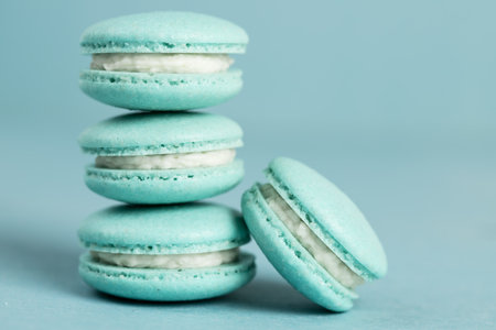 French dessert. Blue sweet macarons on a blue background.の写真素材