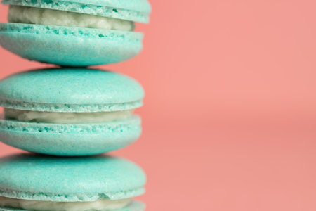 Sweet blue macarons on a pink background with copy space. French dessert.の写真素材
