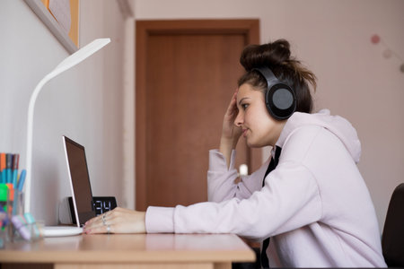 Young beautiful girl learning for an exam. Young girl confused.