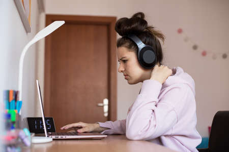 Young beautiful girl learning for an exam. Young girl confused.の写真素材