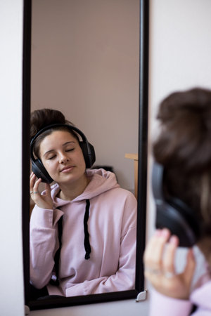 Young girl listening to relaxing music. Girl relaxing.の写真素材