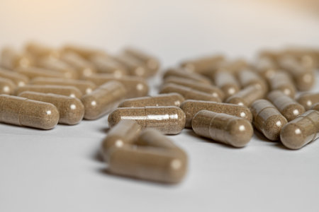 Vitamine E capsules on a white background. Alternative herbal medicine.の写真素材