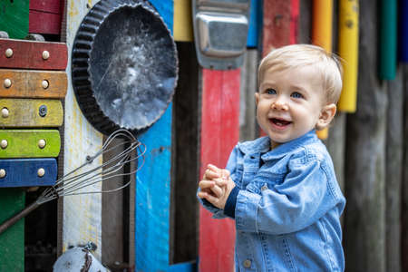 Little blond haired boy playing on the playground. Happy boy.の写真素材